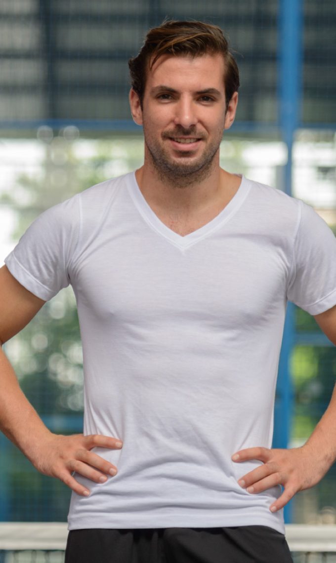 young-handsome-hispanic-man-at-the-tennis-court-SPGQZ84.jpg